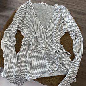 This super cute grey/white striped long sleeve is from caution to the wind sizeM